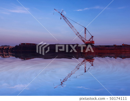 Mirror reflection of Crawler cranes used for Mirror reflection of Crawler cranes used for 50174111