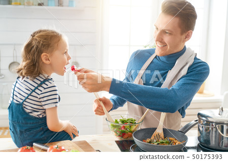 Happy family in the kitchen. 50175393