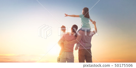 happy family at sunset. 50175506
