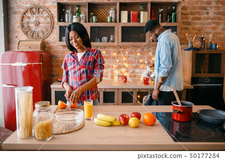 Black love couple cooking romantic dinner 50177284