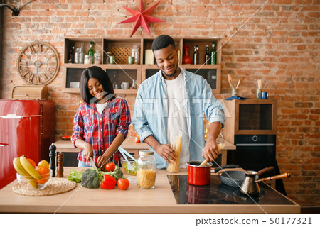 Black love couple cooking romantic dinner Black love couple cooking romantic dinner 50177321