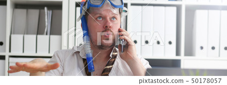 Man wearing suit and tie in goggles and snorkel 50178057