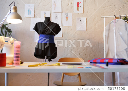 Photo of seamstress room with mannequin, table, sewing machine Photo of seamstress room with mannequin, table, sewing machine 50178208