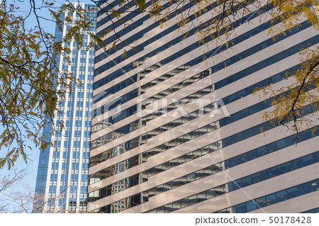 Reflection of a skyscraper on the window panes of another skyscraper in Seattle's financial district Reflection of a skyscraper on the window panes of another skyscraper in Seattle's financial district 50178428