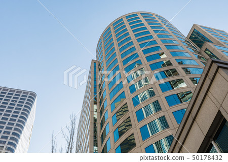 Bottom view of a skyscraper in Seattle on a clear day. Bottom view of a skyscraper in Seattle on a clear day. 50178432
