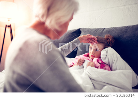 Granddaughter feeling sick after eating too much ice cream Granddaughter feeling sick after eating too much ice cream 50186314