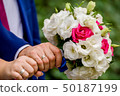 Flowering branch with white delicate flowers on wooden surface. Declaration of love, spring. Wedding 50187199