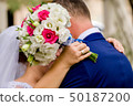 Flowering branch with white delicate flowers on wooden surface. Declaration of love, spring. Wedding 50187200
