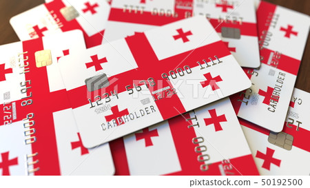 Pile of credit cards with flag of Georgia. Georgian banking system conceptual 3D rendering Pile of credit cards with flag of Georgia. Georgian banking system conceptual 3D rendering 50192500