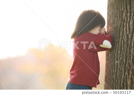 A girl playing 50193117