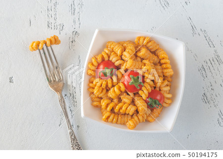 Portion of pasta with tomato and ricotta pesto 50194175