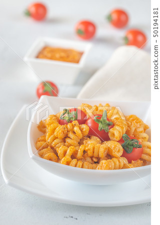 Portion of pasta with tomato and ricotta pesto 50194181