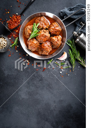 Beef meatballs with spices in tomato sauce 50195249