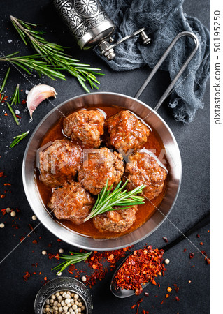 Beef meatballs with spices in tomato sauce 50195250