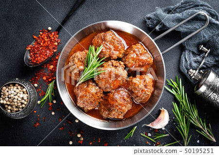 Beef meatballs with spices in tomato sauce Beef meatballs with spices in tomato sauce 50195251