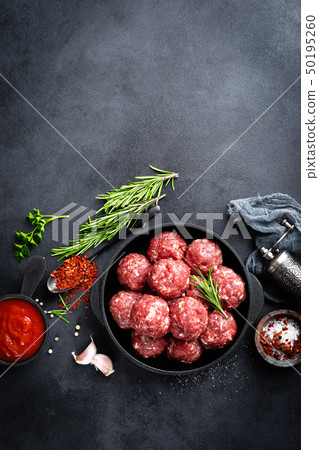 Fresh raw beef meatballs with spices and tomato Fresh raw beef meatballs with spices and tomato 50195260