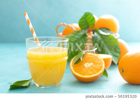Orange freshly squeezed juice in glass and fresh Orange freshly squeezed juice in glass and fresh 50195320