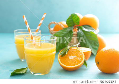 Orange freshly squeezed juice in glass and fresh Orange freshly squeezed juice in glass and fresh 50195321