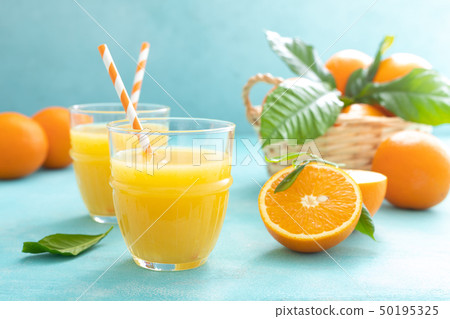 Orange freshly squeezed juice in glass and fresh Orange freshly squeezed juice in glass and fresh 50195325