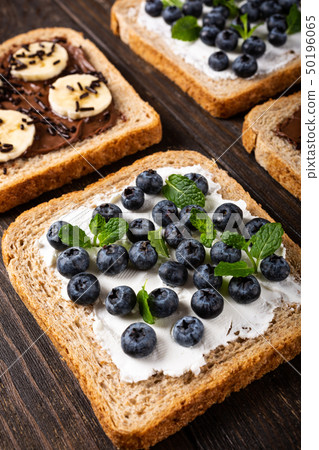 Delicious open sandwich with chocolate and banana 50196065