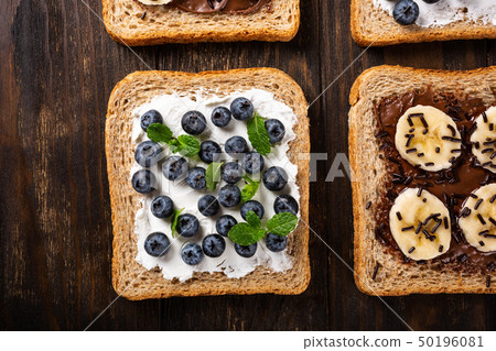 Delicious open sandwich with chocolate and banana Delicious open sandwich with chocolate and banana 50196081