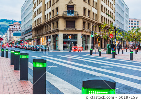 Modern traffic lights posts on pedestrian crossing 50197159