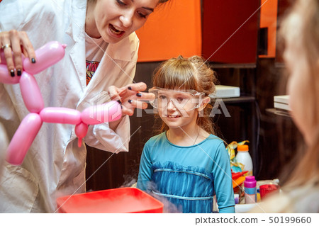 Chemical show for kids. Professor carried out chemical experiments with liquid nitrogen on Birthday Chemical show for kids. Professor carried out chemical experiments with liquid nitrogen on Birthday 50199660