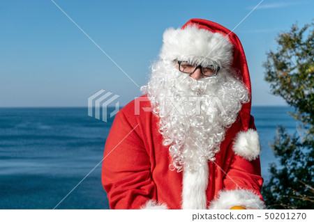 Fat man in glasses dressed as Santa Fat man in glasses dressed as Santa 50201270