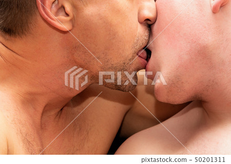 Two guys are kissing. Love and relationships Two guys are kissing. Love and relationships 50201311
