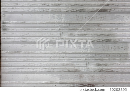 Old grey metal plate with horizontal stripes 50202893