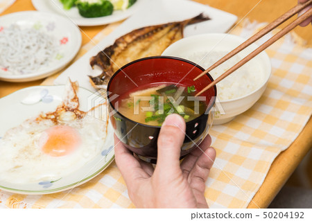 Hand to drink miso soup Hand to drink miso soup 50204192