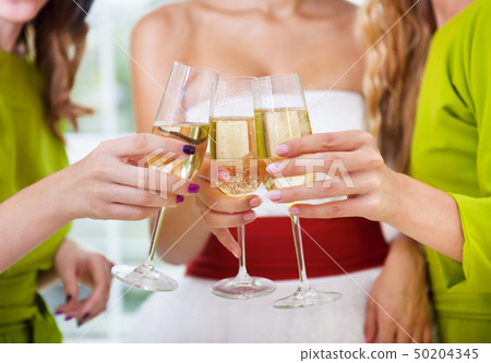Hands of the bride and bridal friends holding Hands of the bride and bridal friends holding 50204345