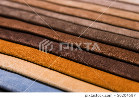 Close-up diagonal lines of textile upholstery in samples to select the color and fabric of the 50204597