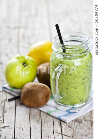 Green smoothie with kiwi, apple, lemon and chia Green smoothie with kiwi, apple, lemon and chia 50204774