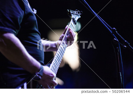 guitarist on stage during concert 50206544