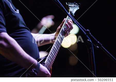 guitarist on stage during concert guitarist on stage during concert 50206551