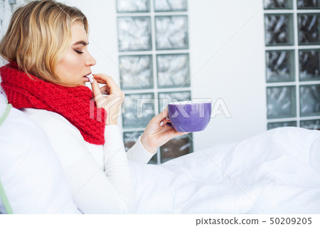 Flu. Woman Suffering From Cold Lying In Bed Flu. Woman Suffering From Cold Lying In Bed 50209205