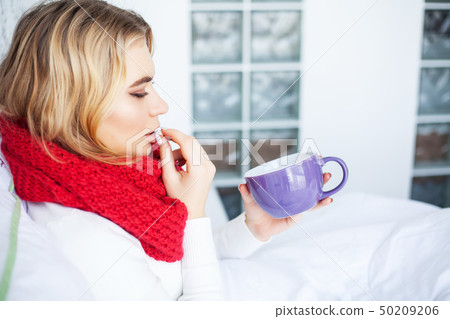 Flu. Woman Suffering From Cold Lying In Bed 50209206