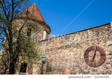 Kaptol fortress and the Antique rusty clock 50209395
