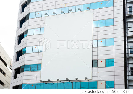 Large blank billboard on a street wall, banners 50211034