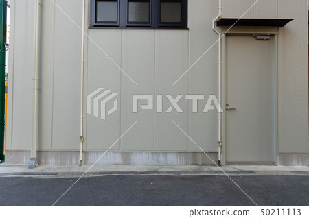 sidewalk by street wall & door sidewalk by street wall & door 50211113