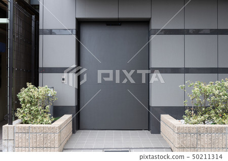 sidewalk by street wall & door sidewalk by street wall & door 50211314