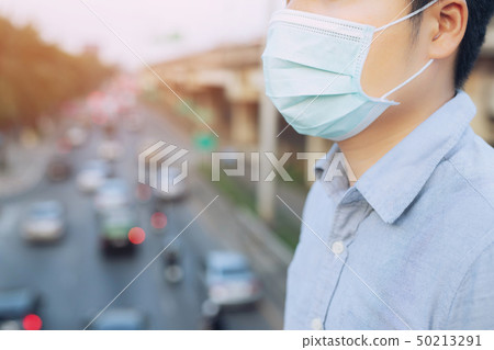 Portrait of man wearing facial hygienic mask nose  50213291