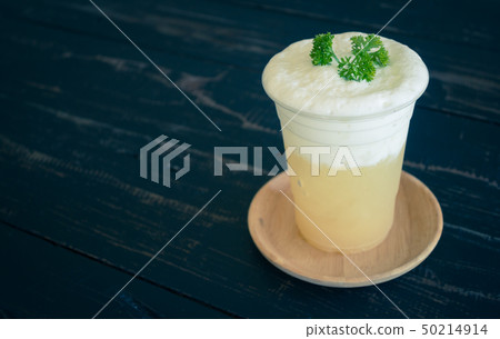 Pineapple juice with Milk froth and Parsley Right Pineapple juice with Milk froth and Parsley Right 50214914