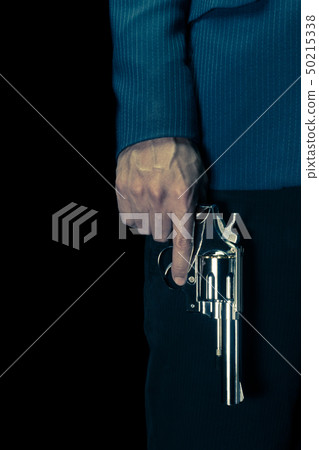 Vintage Man Hold Stainless Gun or Shooter in Hand Vintage Man Hold Stainless Gun or Shooter in Hand 50215338