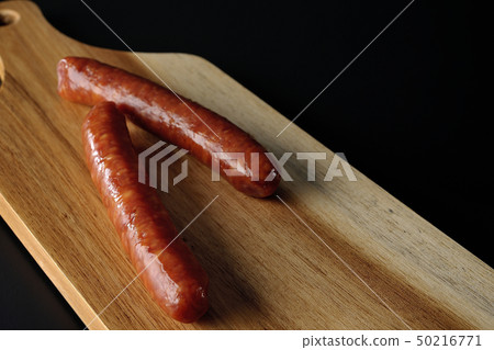 Cutting board and salami sausage Cutting board and salami sausage 50216771