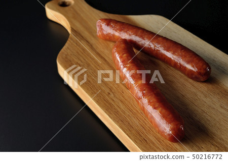 Cutting board and salami sausage Cutting board and salami sausage 50216772