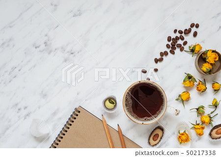 Cup of black coffee and a notebook Cup of black coffee and a notebook 50217338