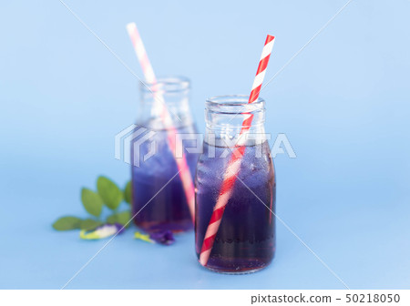 Butterfly pea juce in grass bottle with leaf Butterfly pea juce in grass bottle with leaf 50218050