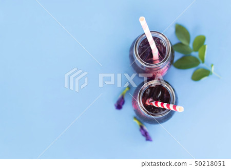 Butterfly pea juce in grass bottle with leaf Butterfly pea juce in grass bottle with leaf 50218051